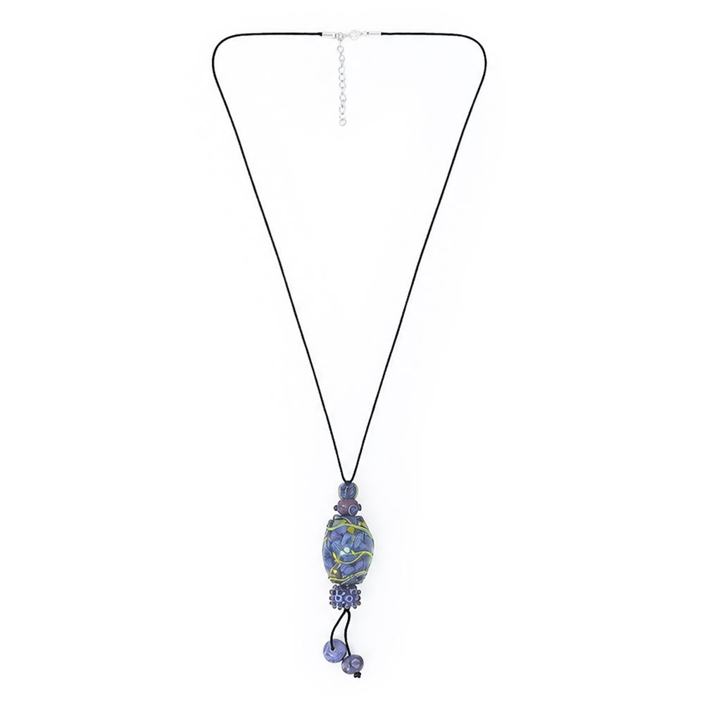 Full view of a long black cord necklace with an elongated blue and purple glass pendant, dangling violet beads, and an adjustable silver-tone chain.