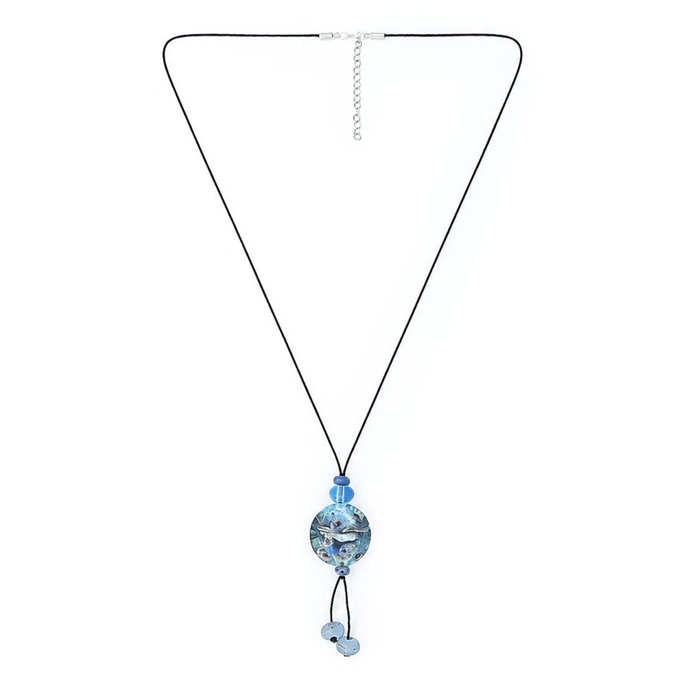 Full view of a long black cord necklace with a round blue glass pendant, dangling pale blue beads, and an adjustable silver-tone chain.