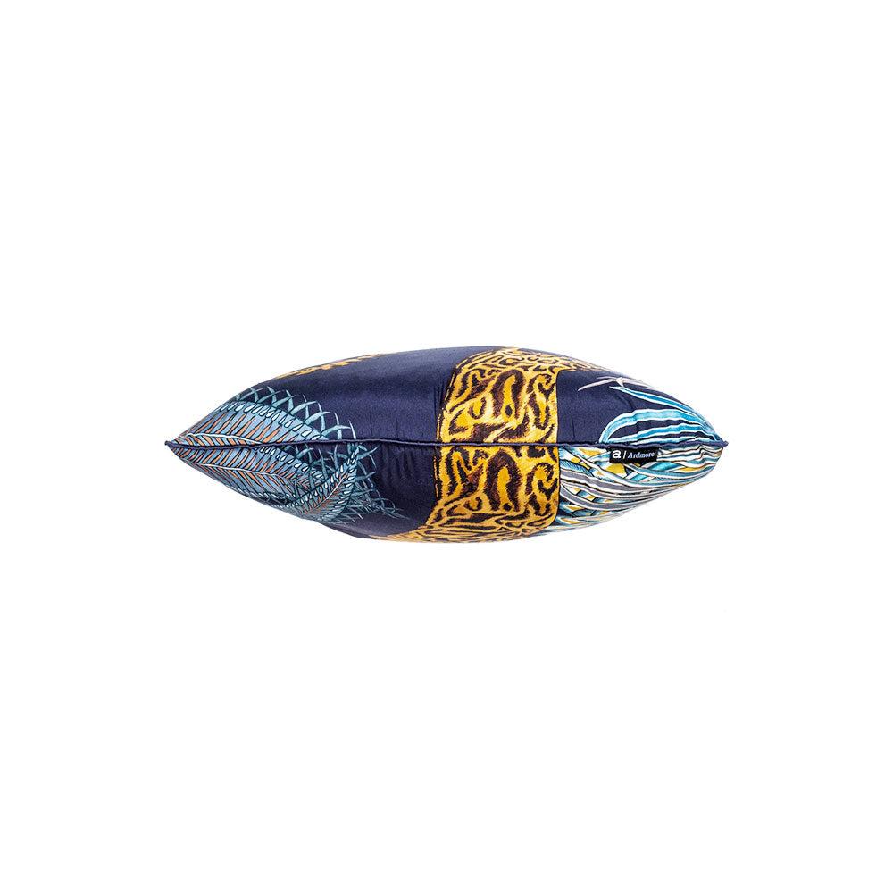 Top-down view showing the filled profile of the navy Cheetah Kings Forest pillow, highlights the continuous pattern execution on both sides.