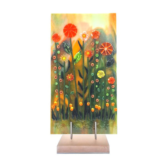 Aventurine green and orange fused glass tulip panel displayed on an acrylic stand.
