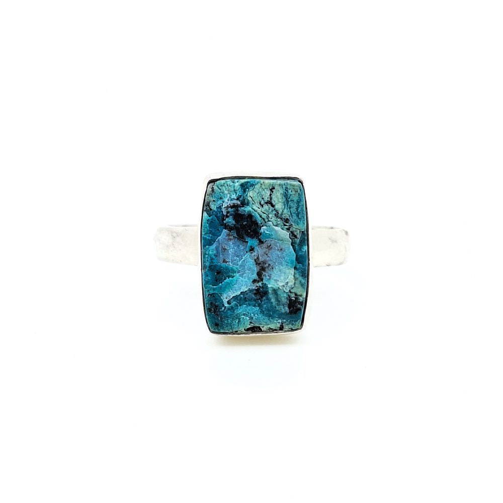 Front view of a chrysocolla ring with a rectangular teal stone centerpiece on a silver-toned band.