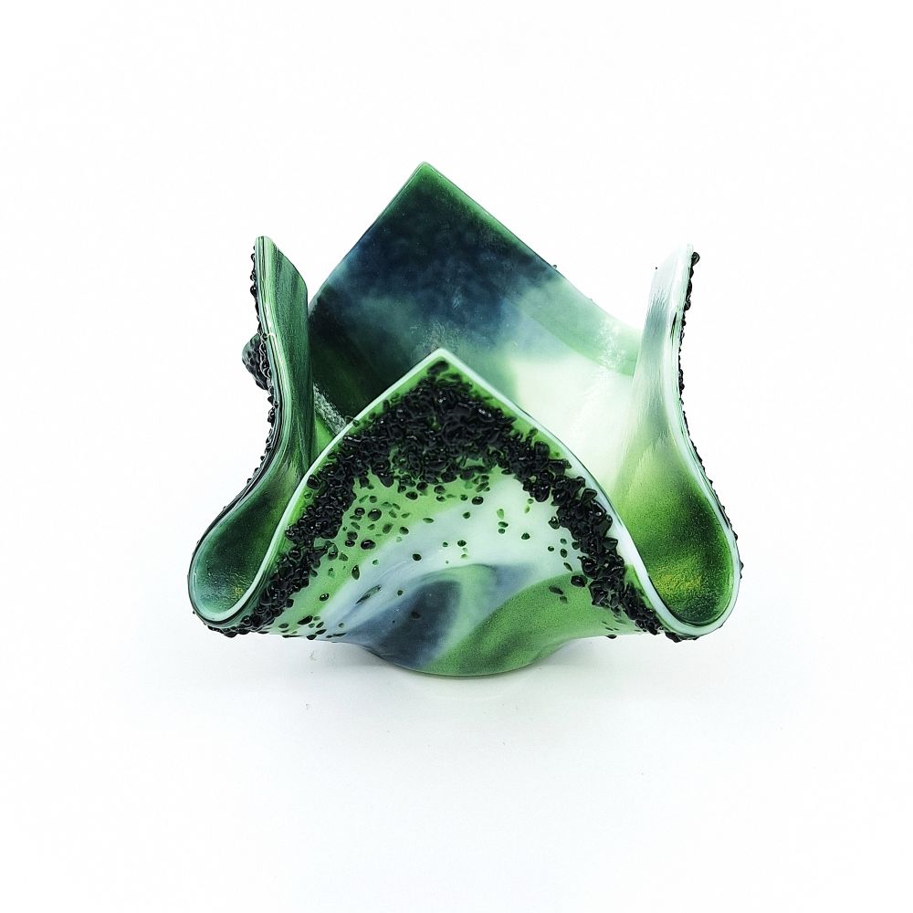 Front view of a handmade green and white glass tulip candle holder with sculpted asymmetrical petals, textured dark green details, and a softly curved base.