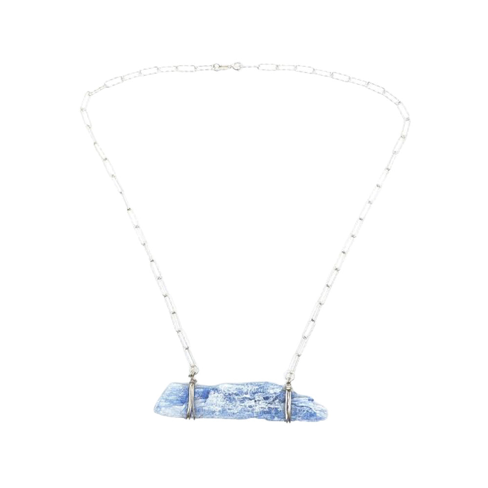 Full view of a kyanite bar necklace featuring a delicate silver-tone chain and a horizontal pale blue natural kyanite crystal pendant on a white background.