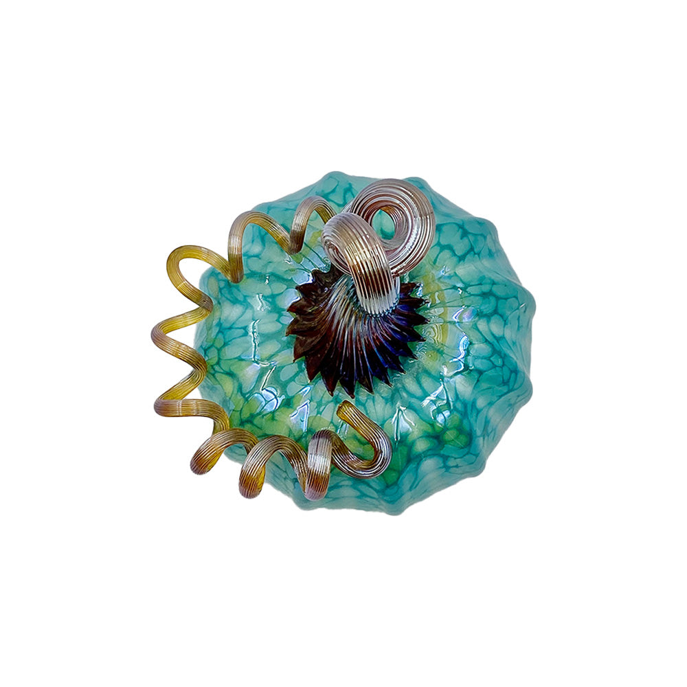 Top view of teal blown glass pumpkin with curled glass stem.
