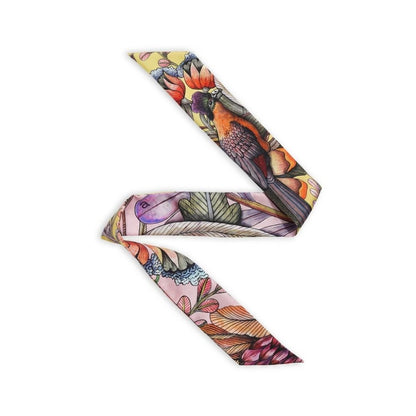 Phinda Pride Flamingo Silk Twill featuring a colorful bird and botanical print in coral, pink, lavender, orange, green, cream, and deep plum tones.