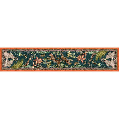 Full view of a long Ardmore table runner decorated with African wildlife, birds, flowers, and botanical details against a dark green background.