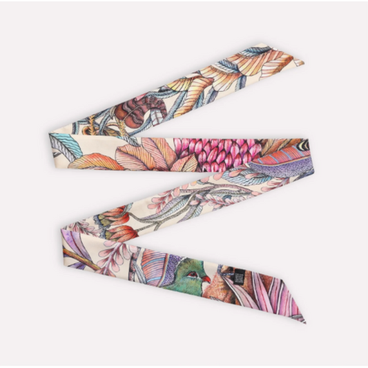 Phinda Pride Parakeet Silk Twill featuring a soft cream background with detailed botanical and bird-inspired artwork in pink, coral, teal, green, lavender, blue, and warm earthy tones.