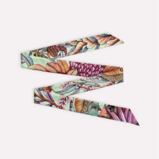 Phinda Pride Jade Silk Twill featuring a cream background with detailed botanical and bird-inspired artwork in jade green, pink, coral, orange, teal, lavender, and earthy tones.