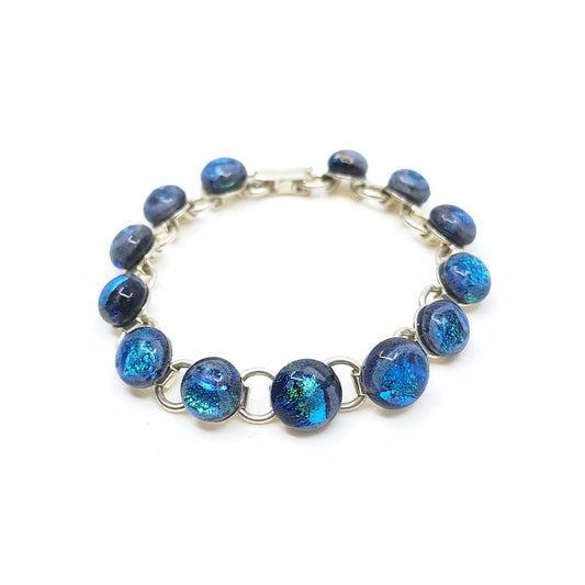 Terra glass bracelet with round blue fused glass links and silver-colored metal.