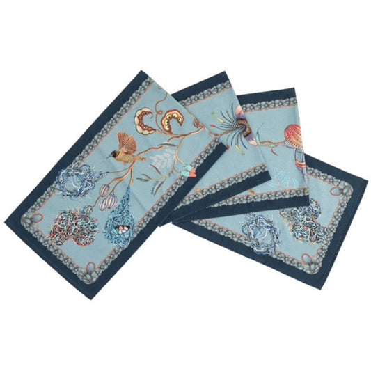 Mist blue Thanda Nest table runners with African masked weaver birds, woven nests, flowers, and dark border.