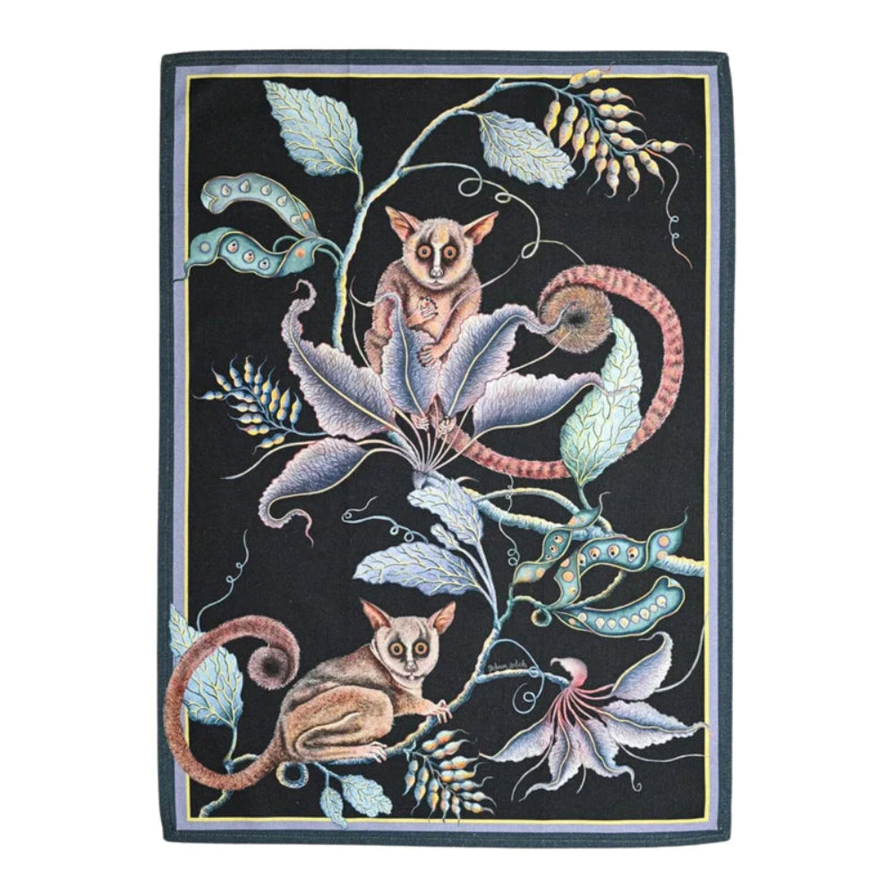 Bush Baby Tea Towel featuring two illustrated bush babies surrounded by curling vines, seed pods, flowers, and layered foliage on a deep black background with a subtle border. 
