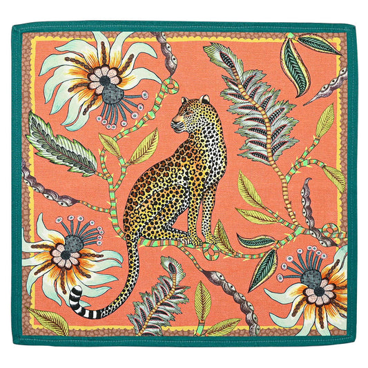 Leopard Napkin in coral with a seated leopard, passion flowers, lucky beans, foliage, and teal border.