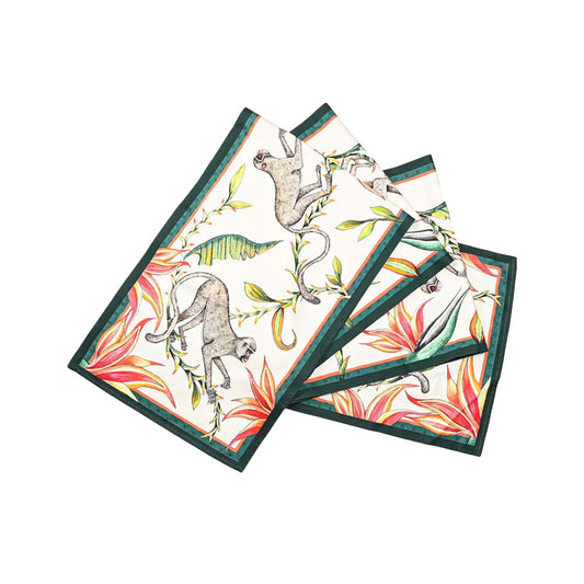 Monkey Paradise Table Runner Large folded to show the repeating monkey and tropical botanical print with coral orange green and cream accents and a dark green border