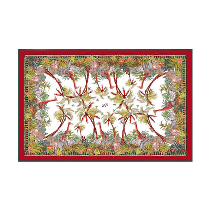 Palm Parade tablecloth with giraffes, elephants, cheetahs, palm trees, aloes, and a red border.