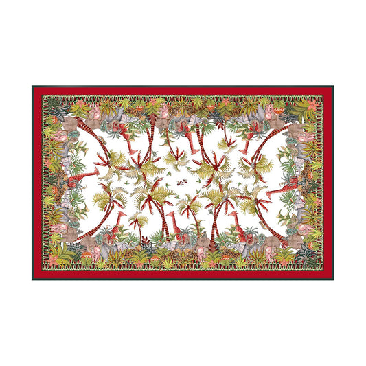Palm Parade tablecloth with giraffes, elephants, cheetahs, palm trees, aloes, and a red border.