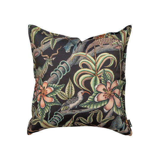 Front view of the square Pangolin Park Pillow on a black backdrop featuring a detailed botanical print with pangolins, leopards, birds, and pink tropical flowers.