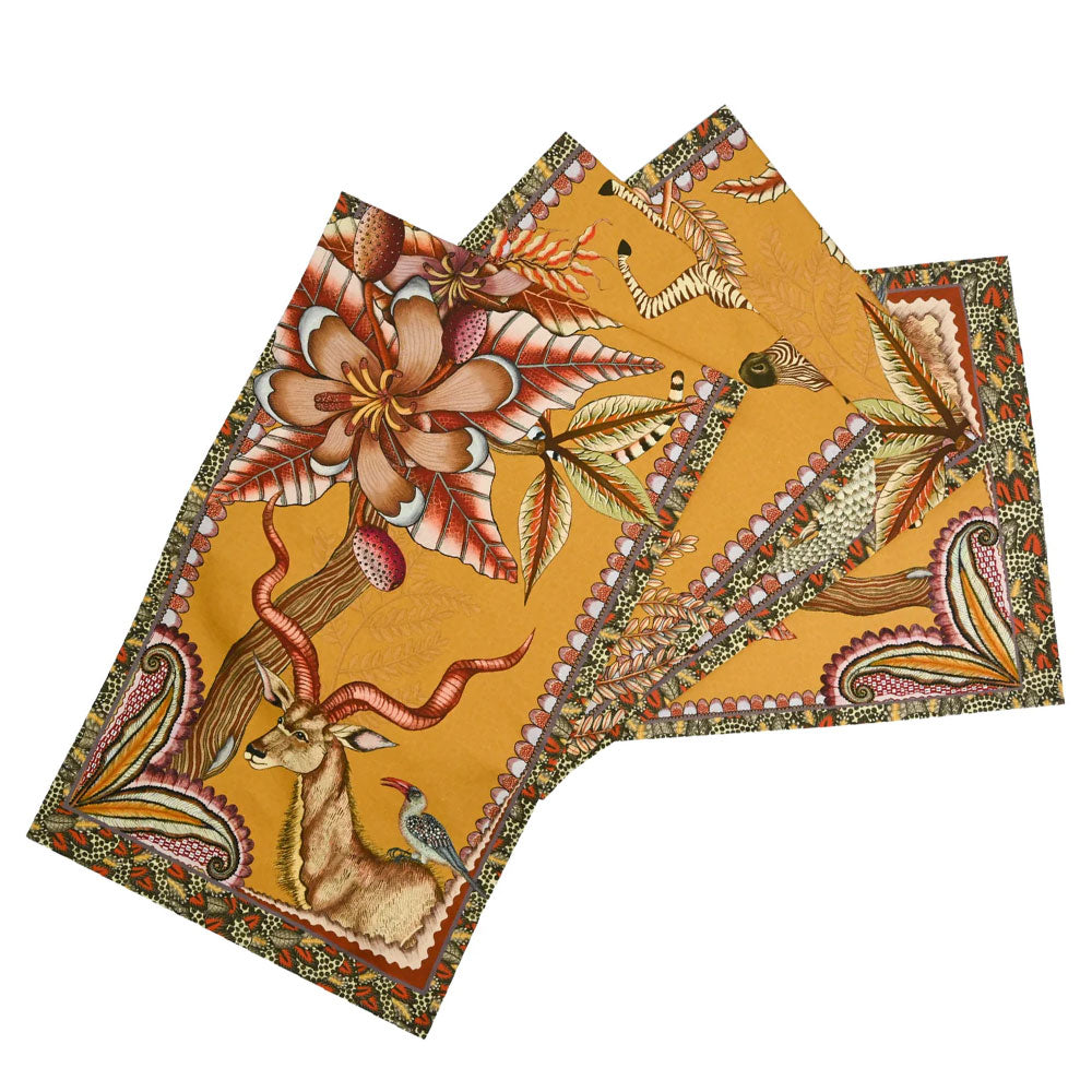 Pangolin Park table runner in flame orange with zebra, kudu, leopard, flowers, and patterned border.