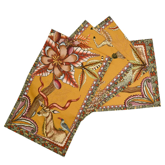 Pangolin Park table runner in flame orange with zebra, kudu, leopard, flowers, and patterned border.