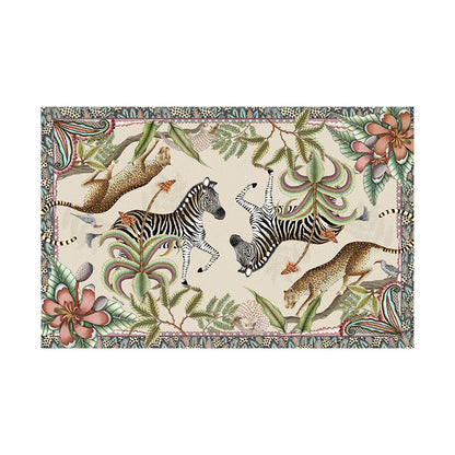 Pangolin Park tablecloth with zebras, leopards, pangolin, aloes, magnolias, and patterned border.