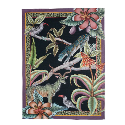 Pangolin Park Tea Towel featuring illustrated pangolins, birds, tropical flowers, and layered foliage on a deep black background with a purple border.