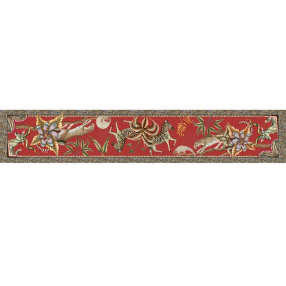 Full view of a long red Ardmore table runner decorated with African wildlife, tropical flowers, curling vines, and ornate patterned borders.