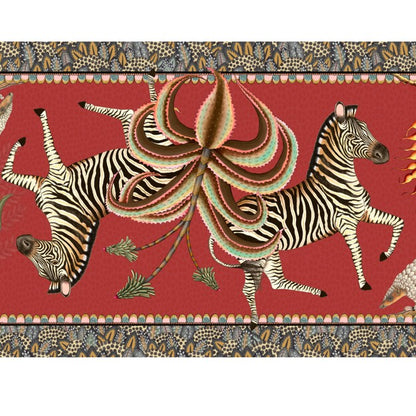 Close-up of the Ardmore table runner featuring two running zebras, a sculptural flower, and intricate patterned borders.