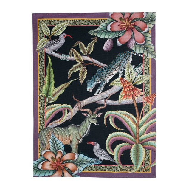 Rectangular Ardmore tea towel featuring a leopard, kudu antelope, birds, tropical flowers, and sculptural foliage on a black background with a purple border.