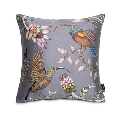 Square gray decorative pillow featuring two colorful long-beaked birds, flowering branches, protea-like blooms, and curling botanical details.