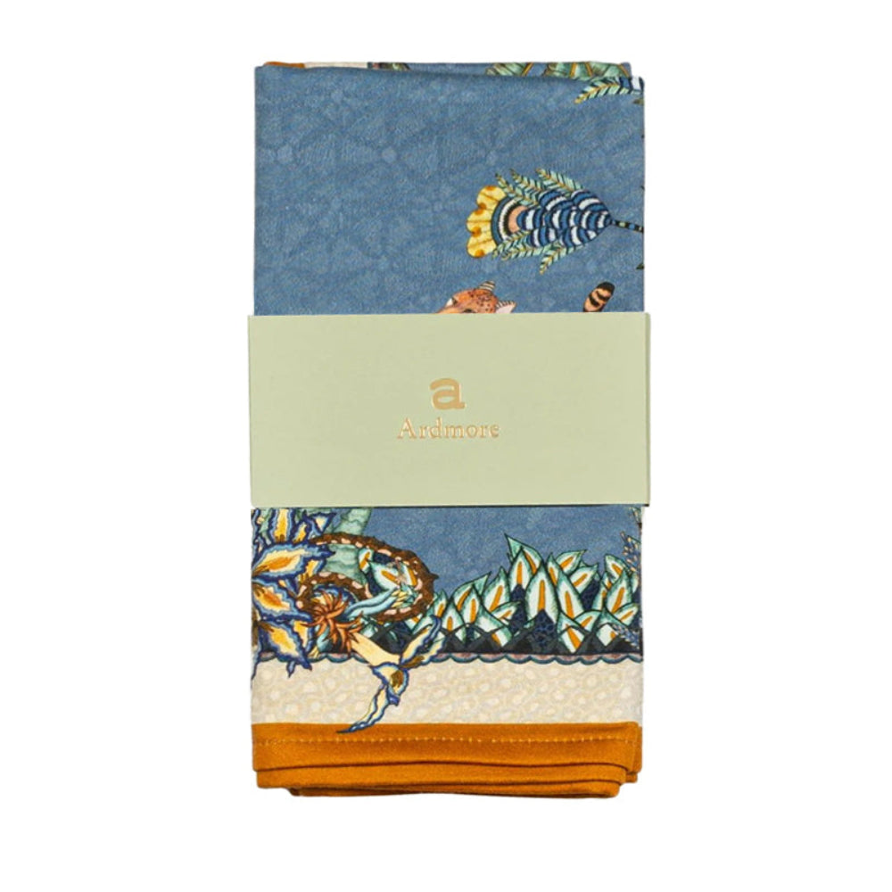Packaged Sabie Forest napkins in Ardmore wrap with blue safari animal and foliage print.