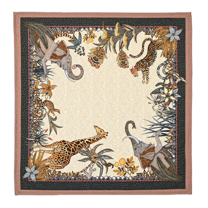 Sabie Forest Napkin featuring a cream center surrounded by illustrated giraffes, elephants, a tiger, tropical foliage, and floral details with dark green and dusty rose borders.