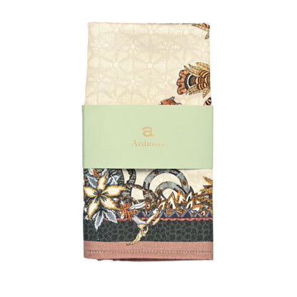 Sabie Forest Napkin featuring a cream center surrounded by illustrated giraffes, elephants, a tiger, tropical foliage, and floral details with dark green and dusty rose borders.