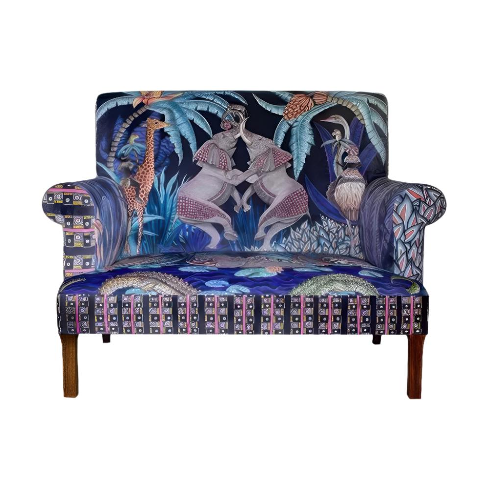 Front view of the Sabie Sofa featuring blue-toned upholstery illustrated with safari animals, including two interactive elephants on the backrest, crocodiles on the seat cushion, and a geometric border.