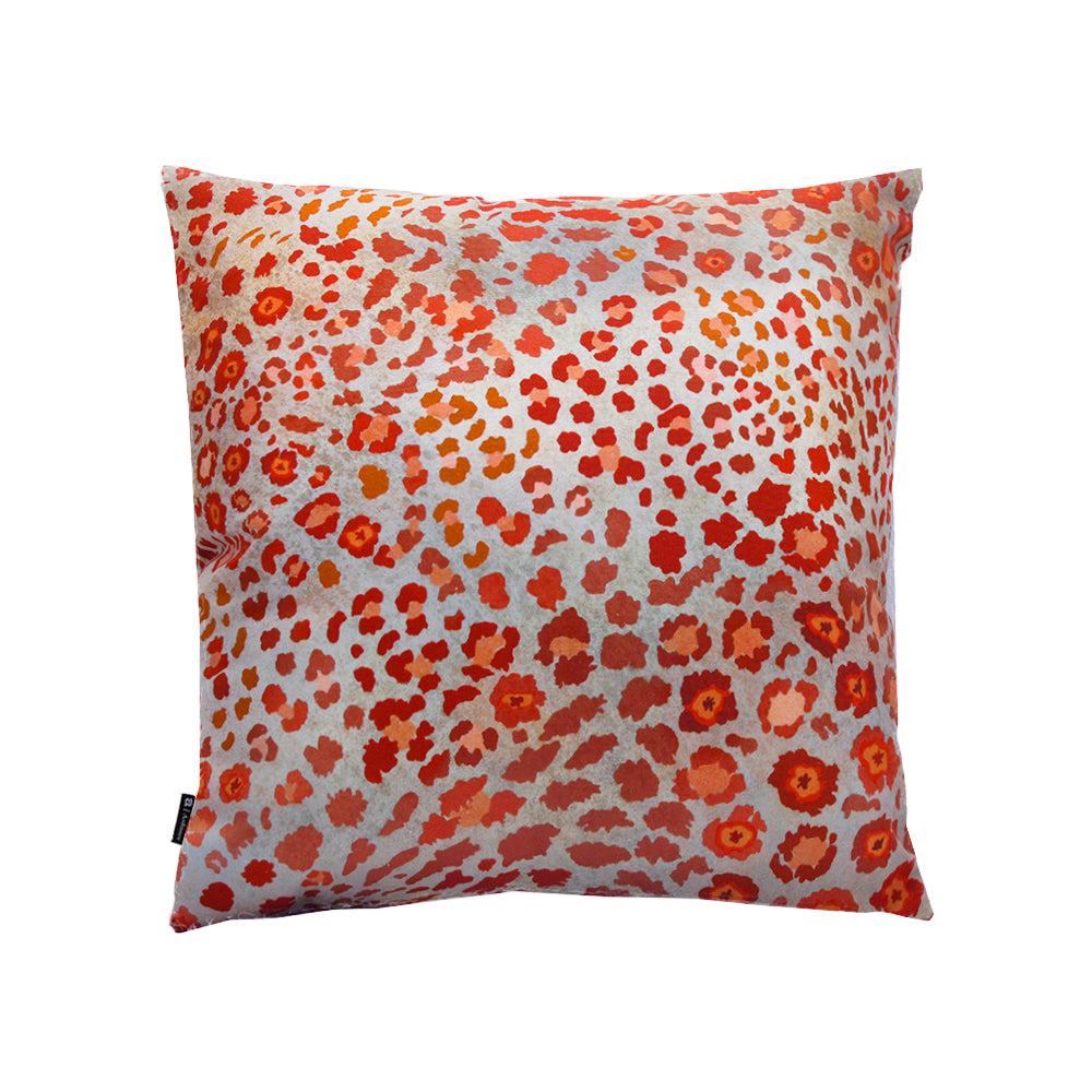 Back view of the square Safari Pillow showcasing the continuous rust-red leopard spot print with piped edges.