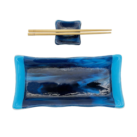 Handmade green glass sushi set featuring a rectangular serving plate, matching square sauce dish, and a pair of light wood chopsticks on a white background.