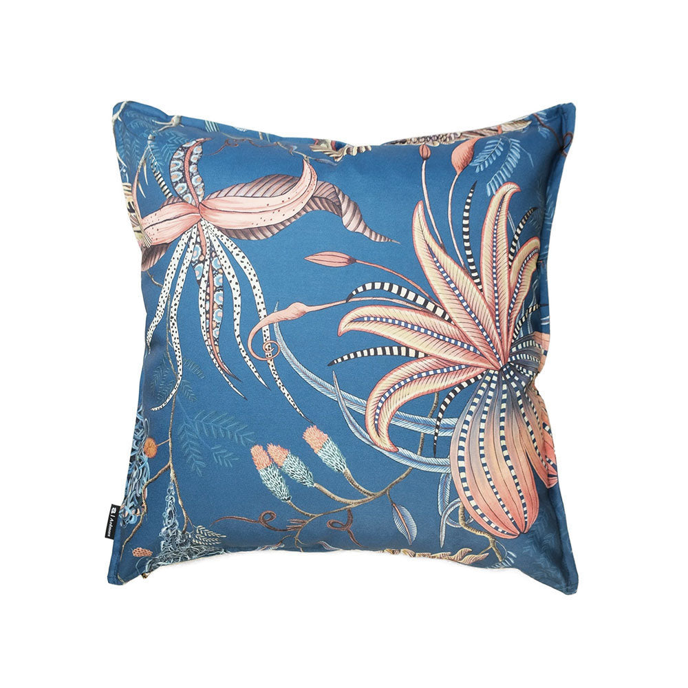 Back view of the square ocean blue Thanda Nest Pillow showcasing stylized pink and orange tropical flora with piped edges.