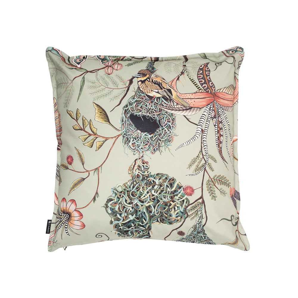 Back view of the square sage green Thanda Nest Pillow showcasing weaver birds sitting on intricate woven nests among tropical vines and pink flowers.