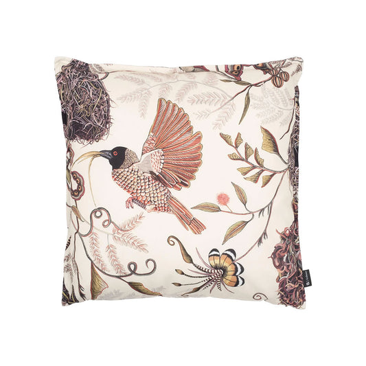 Front view of the square Thanda Nest Pillow in cream featuring a flying weaver bird with outstretched wings among woven nests and tropical foliage.