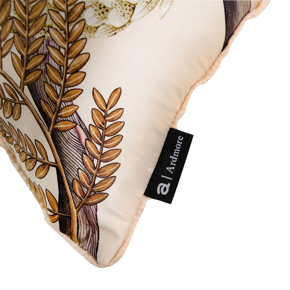 Close-up of Thanda Pangolin pillow showing botanical print, piped trim, and Ardmore label.