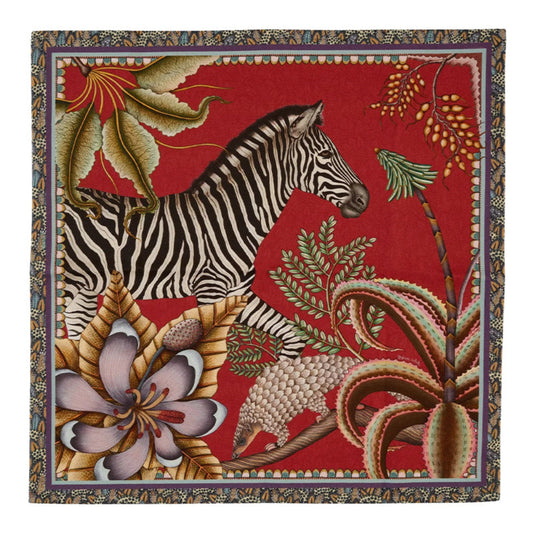 Thanda Stripe napkin in royal red with zebra, pangolin, gardenias, aloes, and patterned border.