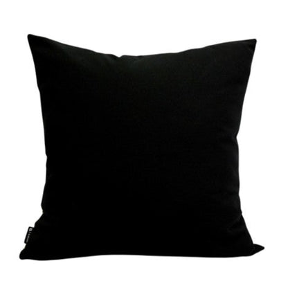 Back view of the Thanda Stripe Pillow showing a solid black fabric cover with a simple square silhouette on a white background.