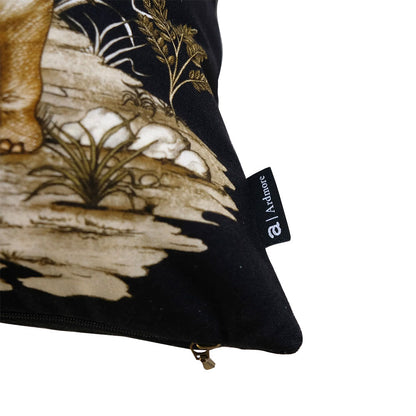 Close-up view of the bottom corner of the black Thanda Toile Pillow highlighting the seam, zipper closure, and attached black Ardmore fabric tag.