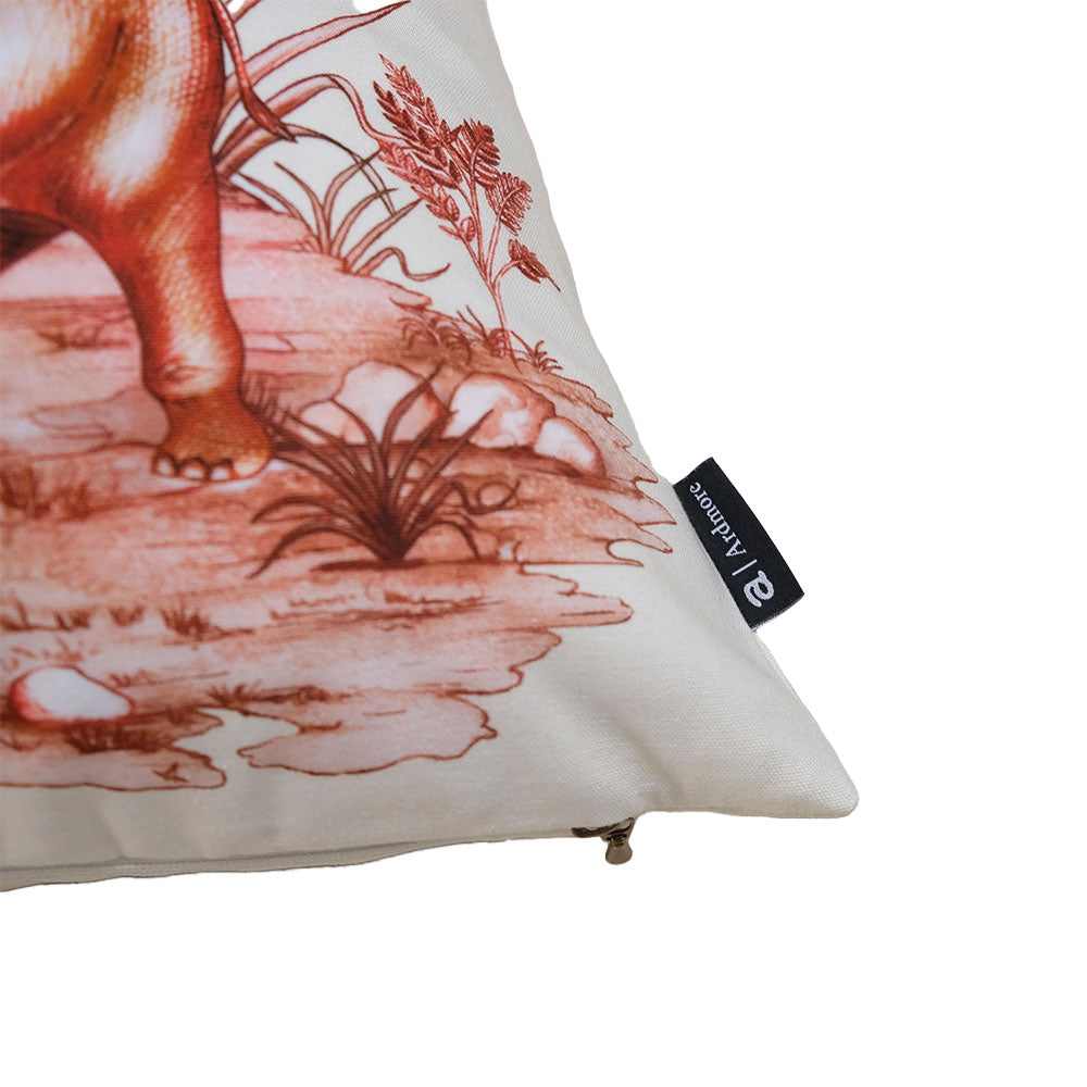Close-up view of the corner of the off-white Thanda Toile Pillow highlighting the seam, zipper closure, and attached black Ardmore fabric tag.