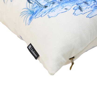 A stack of five Thanda Nest Pillows in various colorways, including cream, sage green, blue, and white botanical print designs.