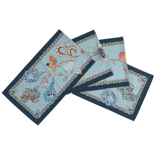 Folded Ardmore table runner featuring colorful birds, woven nests, flowers, curling vines, and botanical details on a pale blue background with a dark blue border.