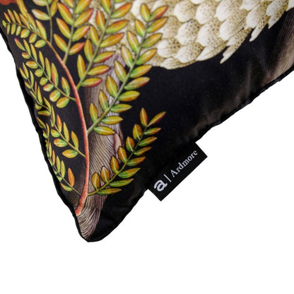 Close-up of the pillow corner with colorful foliage and a black Ardmore brand label.